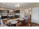 Eat-in kitchen and dining area features wooden table and unique accent chairs and bench at 2626 Solidago Dr, Plainfield, IN 46168