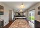 Open concept dining room, seamlessly connecting to the living room and featuring stylish pendant lighting at 2626 Solidago Dr, Plainfield, IN 46168