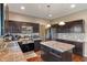 Kitchen features dark wooden cabinets, granite countertops, and stainless steel appliances at 2626 Solidago Dr, Plainfield, IN 46168