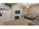 This living room features neutral tones, mounted TV and a plush grey sofa, perfect for relaxation at 2626 Solidago Dr, Plainfield, IN 46168