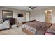 Spacious main bedroom features carpeting, large windows, dresser, mirror, and arm chair at 2626 Solidago Dr, Plainfield, IN 46168