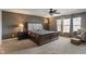 Large main bedroom features large windows providing ample natural light, carpet, and ceiling fan at 2626 Solidago Dr, Plainfield, IN 46168