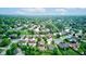 Panoramic aerial view of a residential community with a pond and surrounded by verdant trees at 286 N Greenbriar Dr, Greenwood, IN 46142