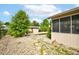 Backyard view of a screened in porch with a swimming pool, shed, and large trees at 286 N Greenbriar Dr, Greenwood, IN 46142