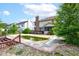 Backyard view of a pool, house, deck, and surrounding landscape under a sunny sky at 286 N Greenbriar Dr, Greenwood, IN 46142