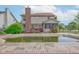 Exterior of a two story home with a pool, deck, sunroom, chimney, and fenced yard at 286 N Greenbriar Dr, Greenwood, IN 46142
