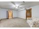Finished basement with carpet, ceiling fan, and door leading to another room at 286 N Greenbriar Dr, Greenwood, IN 46142