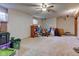 Spacious basement with carpet flooring, ceiling fan, and natural light from egress windows at 286 N Greenbriar Dr, Greenwood, IN 46142