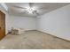 Finished basement area with neutral carpet, ceiling fan, and natural light at 286 N Greenbriar Dr, Greenwood, IN 46142