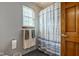 Bathroom featuring gray walls, a towel rack, and shower with blue and white curtain at 286 N Greenbriar Dr, Greenwood, IN 46142