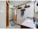Bathroom boasts tiled shower, shelves, modern faucet, and tile floors at 286 N Greenbriar Dr, Greenwood, IN 46142