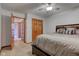 Bedroom with neutral carpet, a ceiling fan and walk-in closets at 286 N Greenbriar Dr, Greenwood, IN 46142