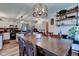 Open concept dining area into kitchen with stainless steel appliances and white cabinets at 286 N Greenbriar Dr, Greenwood, IN 46142