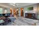 Open-concept living room boasts a comfortable sectional sofa, wood floors, and seamless flow to other living spaces at 286 N Greenbriar Dr, Greenwood, IN 46142