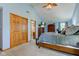 Bright main bedroom with vaulted ceiling, mounted TV, and walk-in closet at 286 N Greenbriar Dr, Greenwood, IN 46142