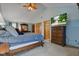 The main bedroom features vaulted ceilings, wooden dresser, and mounted TV at 286 N Greenbriar Dr, Greenwood, IN 46142