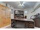 Home office with a large, dark wood desk, built in storage, and neutral walls and carpeting at 286 N Greenbriar Dr, Greenwood, IN 46142