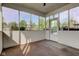 Enclosed sunroom with neutral carpeting, white walls, and ample natural light at 286 N Greenbriar Dr, Greenwood, IN 46142
