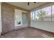 Enclosed back patio area with brick walls and a door leading outside at 286 N Greenbriar Dr, Greenwood, IN 46142
