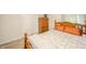 Bedroom with wood furniture, including a bed, nightstand, dresser, and two windows at 2900 Helms Rd, Anderson, IN 46016