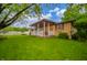 A charming home with a covered porch and well-maintained landscaping provides curb appeal at 2900 Helms Rd, Anderson, IN 46016