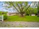 Attractive brick home featuring a covered porch, attached garage, and a well-manicured lawn at 2900 Helms Rd, Anderson, IN 46016