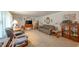 Cozy living room featuring comfortable seating, neutral carpet, and natural light from large windows at 2900 Helms Rd, Anderson, IN 46016