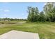 Expansive backyard featuring a peaceful pond surrounded by lush greenery at 331 Oxford Ln, Lebanon, IN 46052