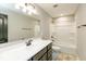 Bathroom featuring marble floor, white sink and vanity, and shower-tub combination at 331 Oxford Ln, Lebanon, IN 46052