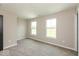 Cozy bedroom with neutral carpet and paint, brightened by two large windows at 331 Oxford Ln, Lebanon, IN 46052