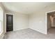 Neutral bedroom featuring gray carpet, light gray walls, and a black door at 331 Oxford Ln, Lebanon, IN 46052