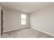 Neutral bedroom featuring gray carpet, light gray walls, and a window at 331 Oxford Ln, Lebanon, IN 46052