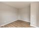 A bedroom with hardwood floors and light-colored walls offers a neutral palette at 331 Oxford Ln, Lebanon, IN 46052
