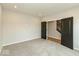 A bedroom with plush carpet and stylish black doors at 331 Oxford Ln, Lebanon, IN 46052