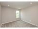 Neutral bedroom featuring gray carpet, light gray walls, and a window at 331 Oxford Ln, Lebanon, IN 46052