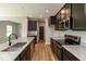 Well-equipped kitchen with granite countertops, stainless steel appliances, a sink, and dark cabinets at 331 Oxford Ln, Lebanon, IN 46052