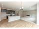 Modern kitchen with granite island and stainless appliances open to the living room with fireplace at 331 Oxford Ln, Lebanon, IN 46052