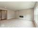 A living room with plush carpets and a fireplace at 331 Oxford Ln, Lebanon, IN 46052
