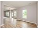 Bright living room featuring hardwood floors and multiple windows at 331 Oxford Ln, Lebanon, IN 46052
