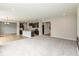 Spacious living space showcasing an open-concept layout and plush carpeting at 331 Oxford Ln, Lebanon, IN 46052