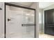 Modern shower with glass door and black hardware in a neutral bathroom at 331 Oxford Ln, Lebanon, IN 46052