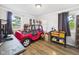 bedroom with a themed car bed, wood-look floors, and a bright atmosphere at 3400 Debra Dr, Anderson, IN 46012