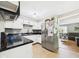 Functional kitchen with white cabinets, stainless steel appliances, and black countertops at 3400 Debra Dr, Anderson, IN 46012