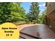 Large back deck offers outdoor living with grilling space, seating, and lush green surroundings at 3479 Sugar Loaf Ct, Carmel, IN 46033