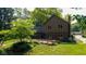 Manicured backyard with wooden deck, mature trees, and professional landscaping at 3479 Sugar Loaf Ct, Carmel, IN 46033