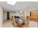 Spacious basement area featuring a dining table, chairs, and a built-in wooden cabinet for storage at 3479 Sugar Loaf Ct, Carmel, IN 46033