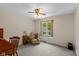 Cozy bedroom featuring a chair, desk, and a window with natural light at 3479 Sugar Loaf Ct, Carmel, IN 46033