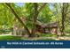 Charming two-story brick home with a landscaped yard and mature trees, offering a serene and private setting at 3479 Sugar Loaf Ct, Carmel, IN 46033
