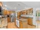 Spacious kitchen with stainless steel appliances, granite countertops, and wood cabinets at 3479 Sugar Loaf Ct, Carmel, IN 46033