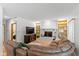 Spacious living room with a fireplace, built-in shelves, and a comfortable sectional sofa at 3479 Sugar Loaf Ct, Carmel, IN 46033